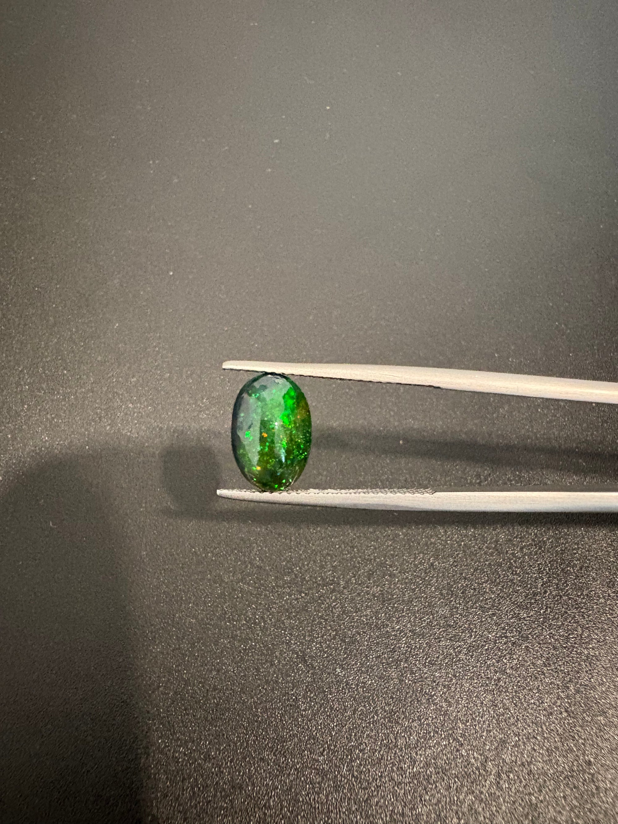 Black Opal oval shape 11x7.5 mm approximately 2.15 carat (GTG-BOP-59)