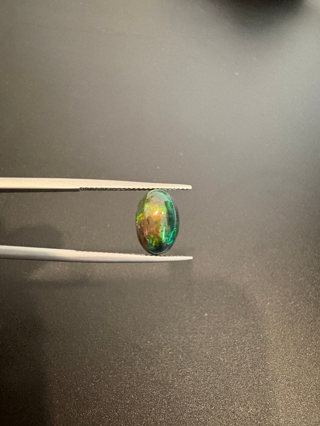 Black Opal oval shape 10x8mm approximately 3 carat (GTG-BOP-7)