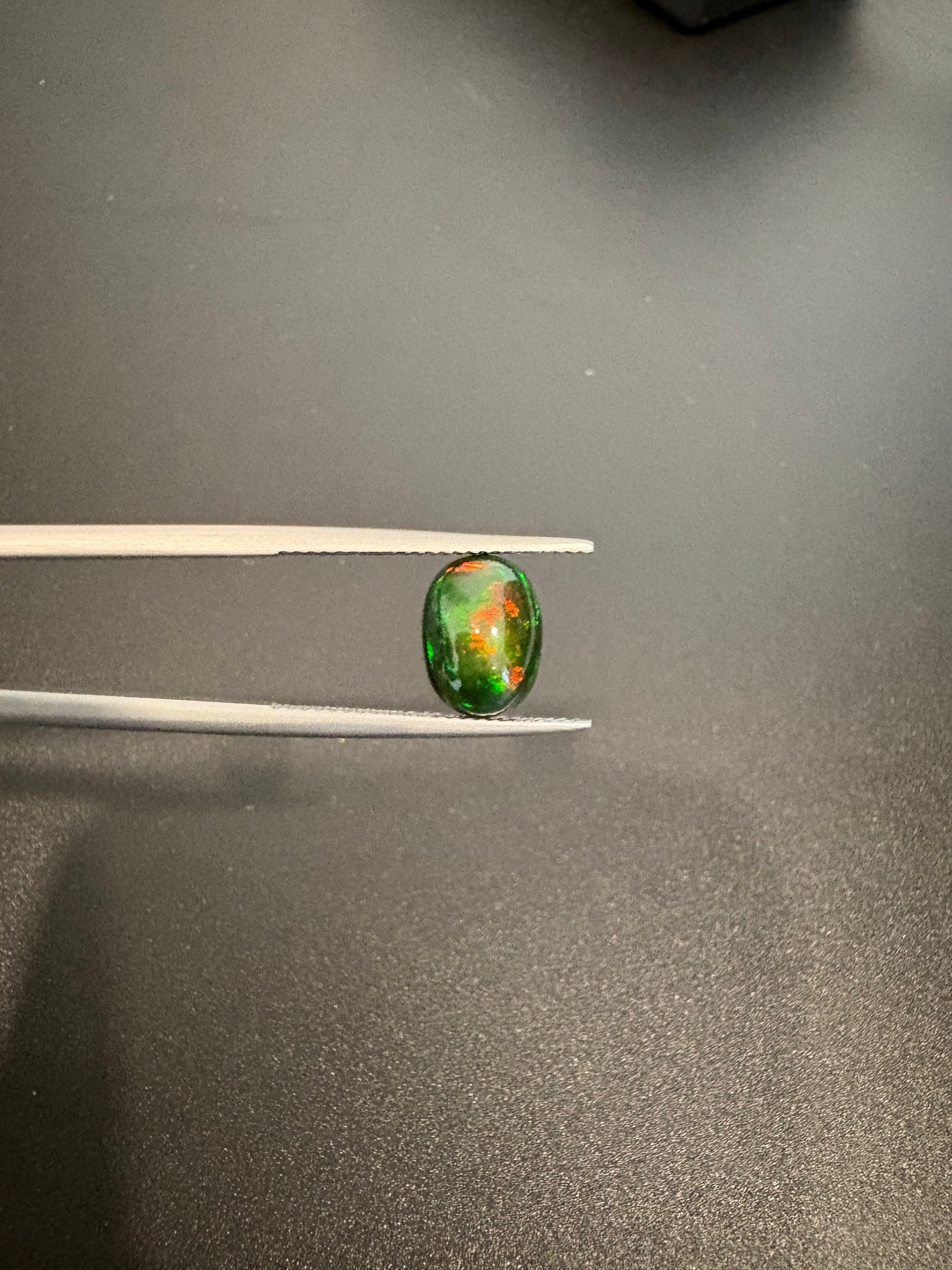 Black Opal oval shape 10.5x8mm approximately 1.90 carat (GTG-BOP-4)