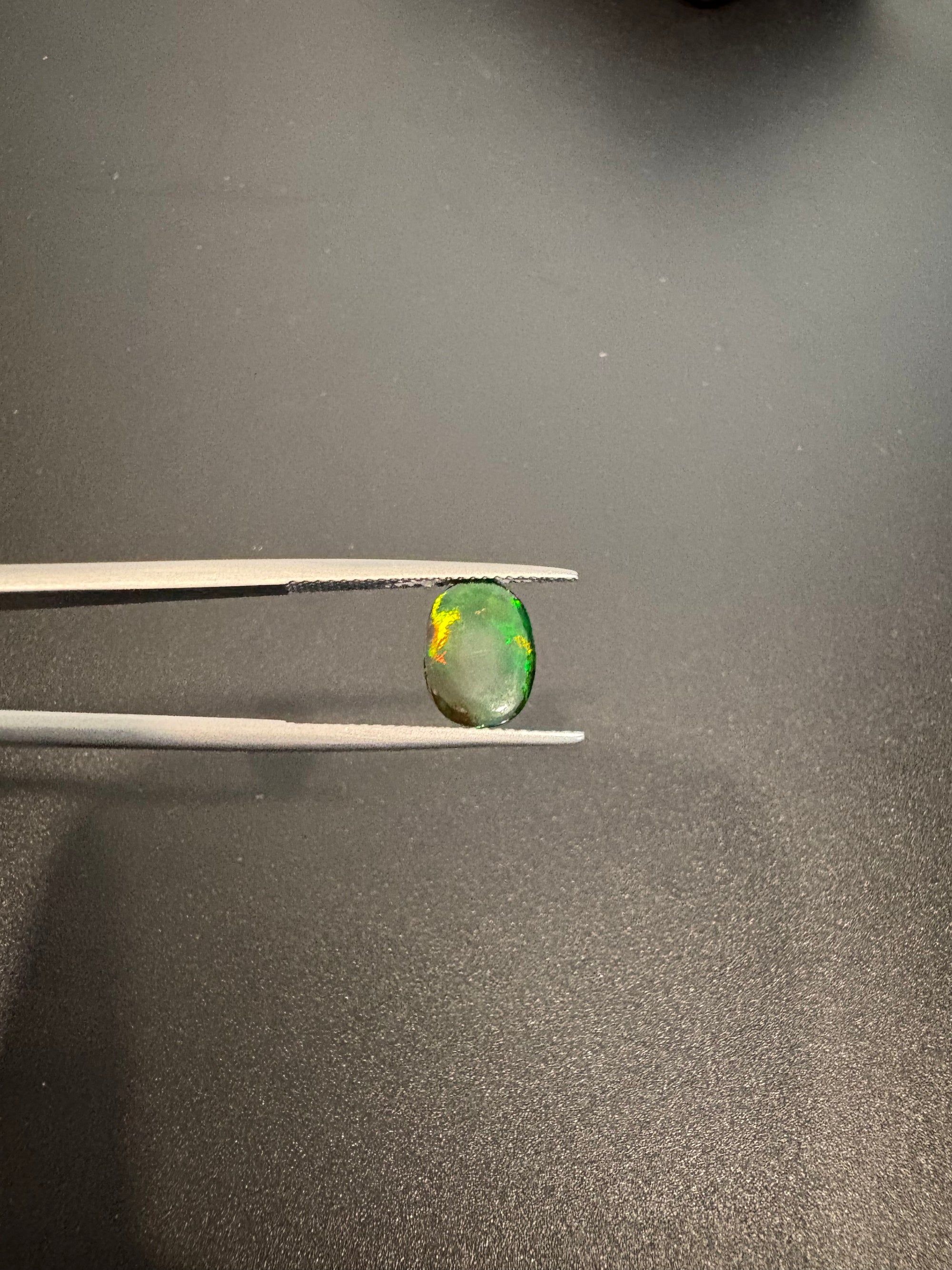 Black Opal oval shape 10.5x8mm approximately 1.90 carat (GTG-BOP-4)