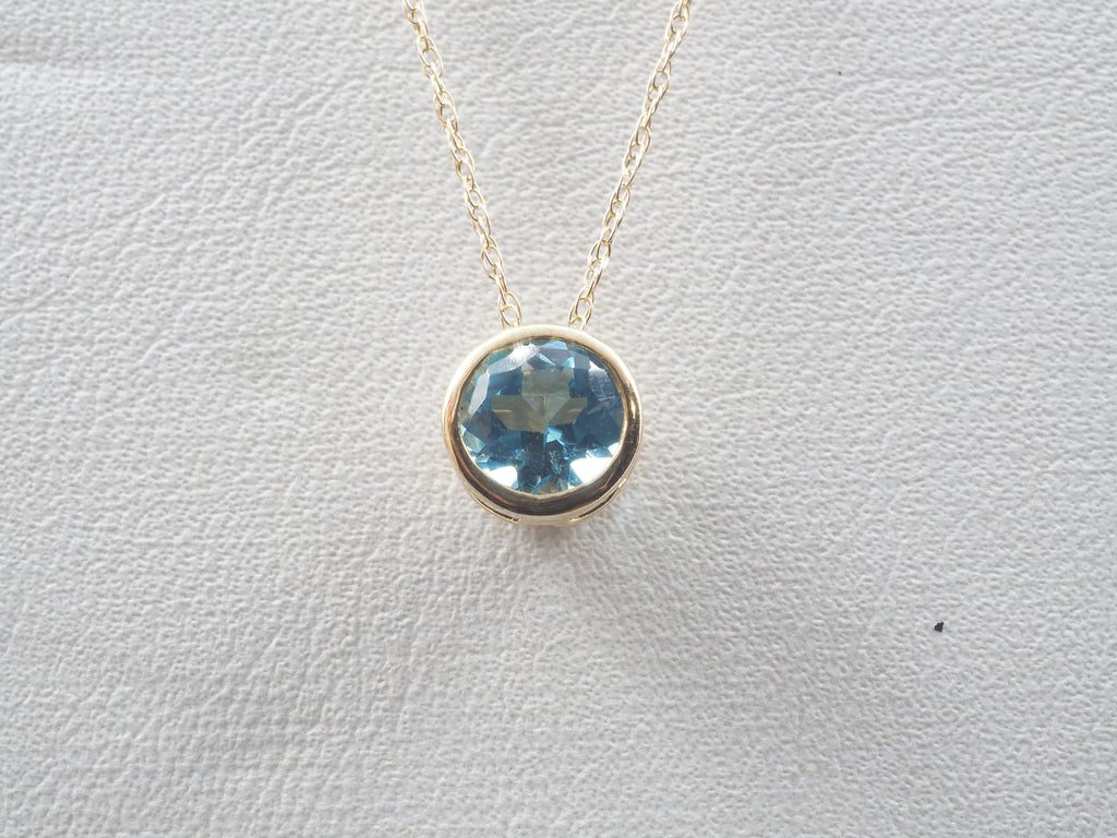 10K Yellow Gold Blue Topaz stud and Pendant