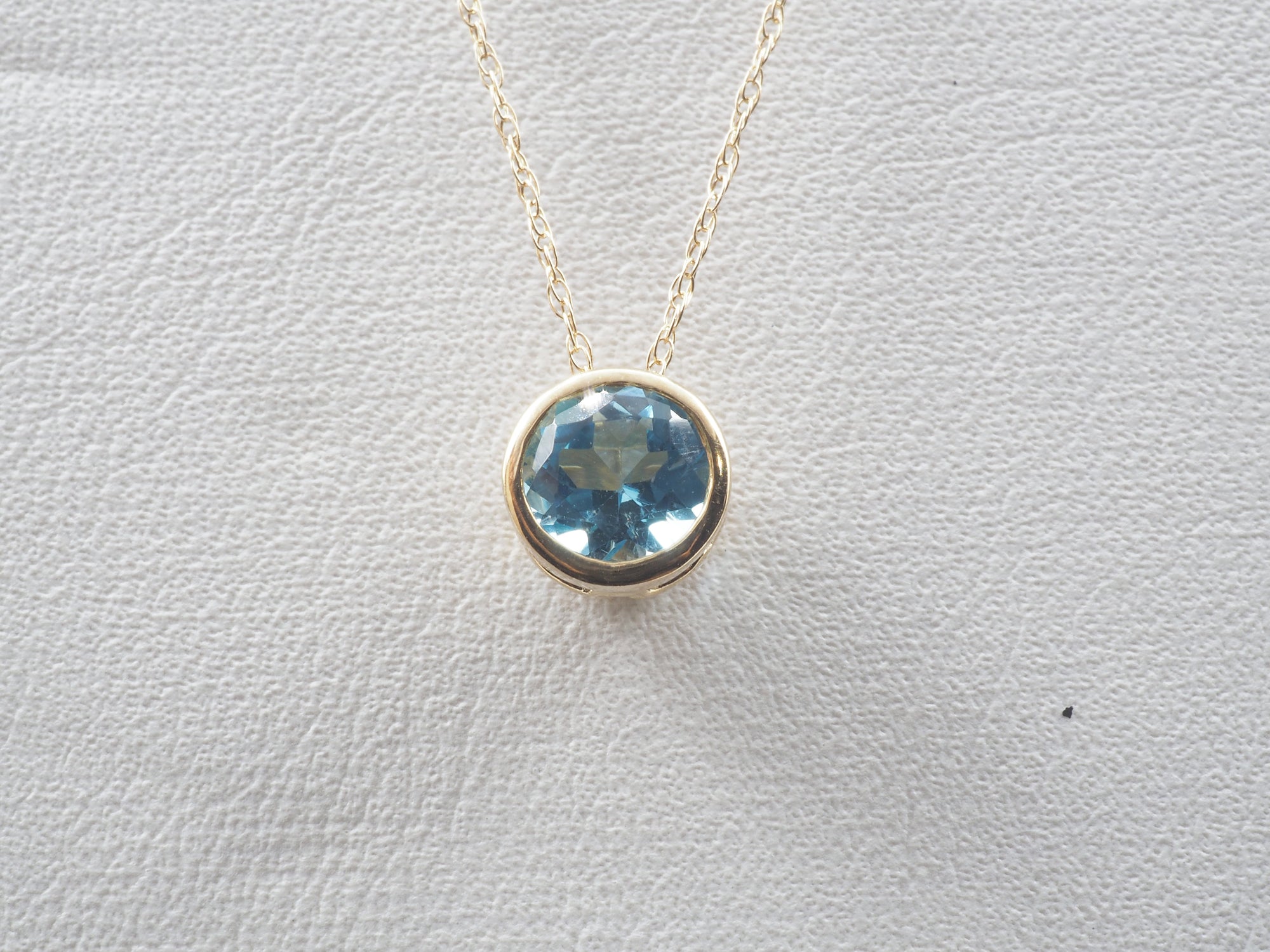 10K Yellow Gold Blue Topaz stud and Pendant